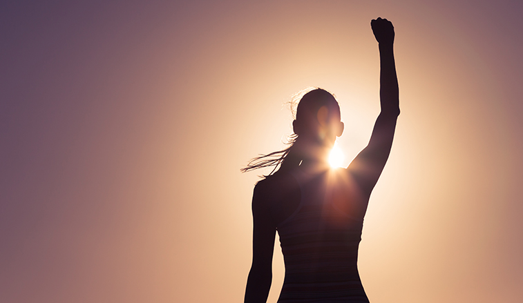 Woman holding up a fist