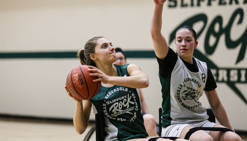 Woman shooting a basketball