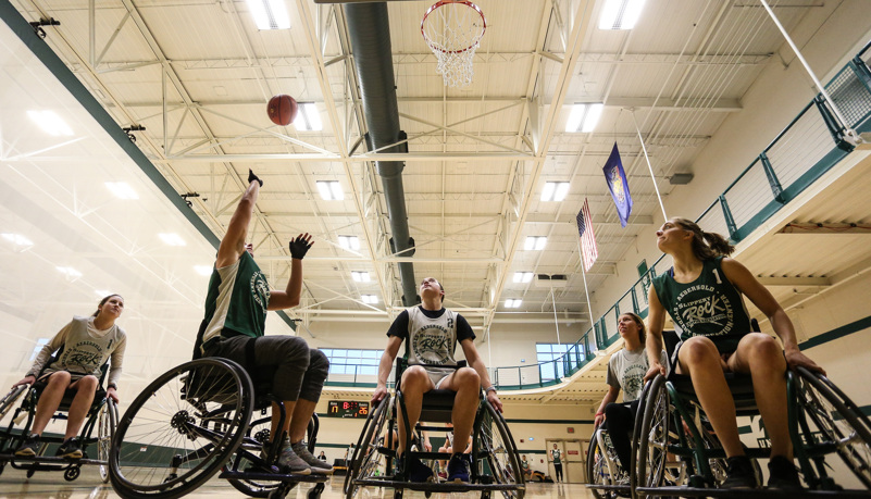 Woman shooting a basketball