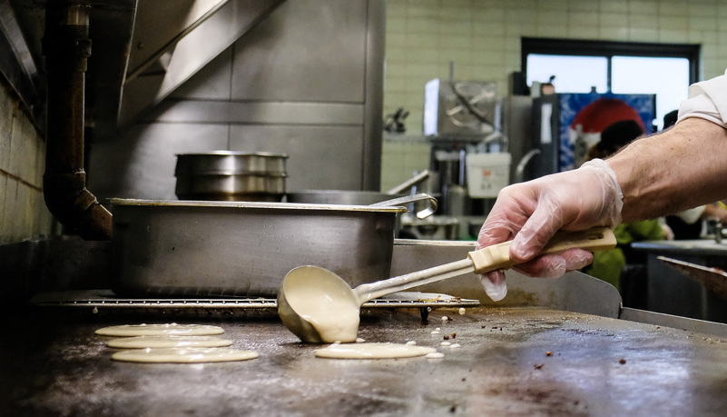 Cook making Pancakes