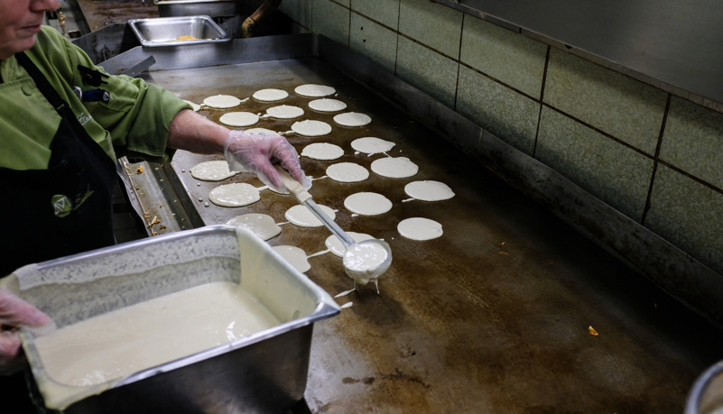 Cook making Pancakes