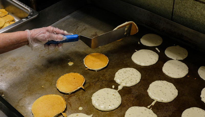 Cook making Pancakes