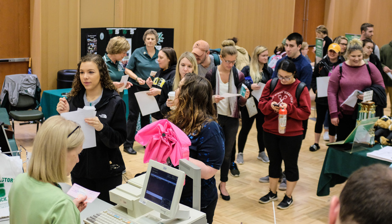 Students waiting in line for gowns