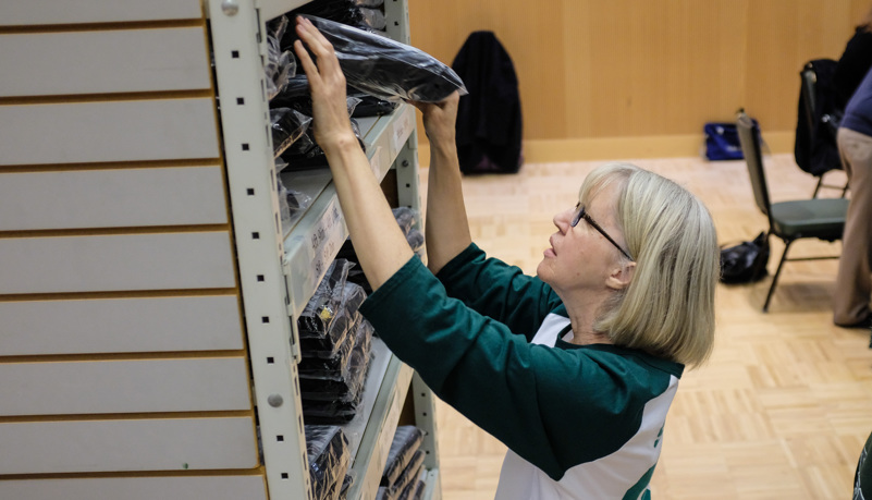 Woman selecting a gown and cap