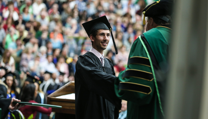 Student receives his diploma