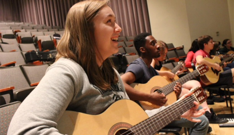 Woman Playing guitar