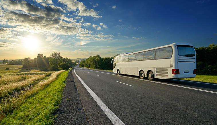 Coach bus driving down the highway