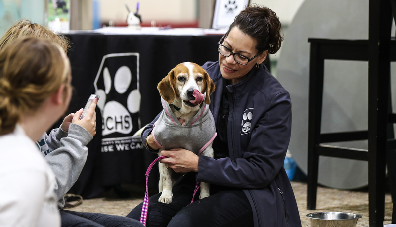 Woman from the Butler Humane society with a dog