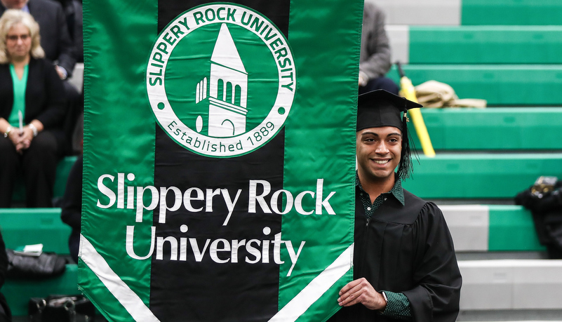 Man carrying the university banner