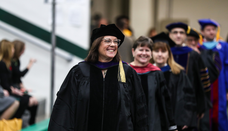 faculty members enter the event