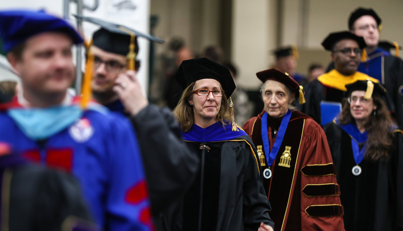 faculty members enter the event