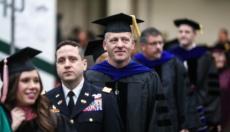 faculty members enter the event