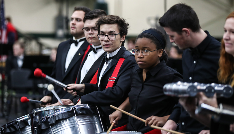 students play the drums