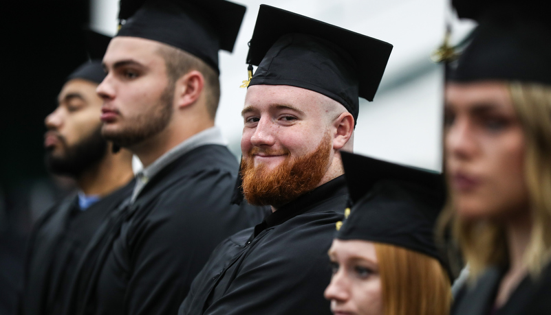 a male student smiles for the camera