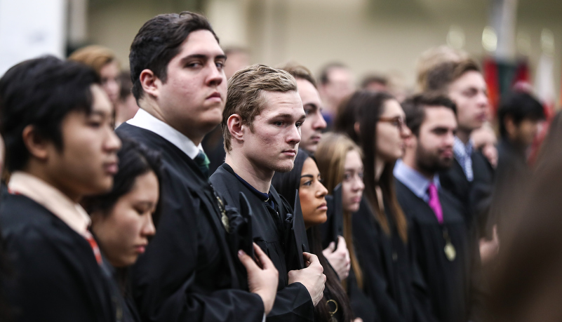 students listen to the national anthem