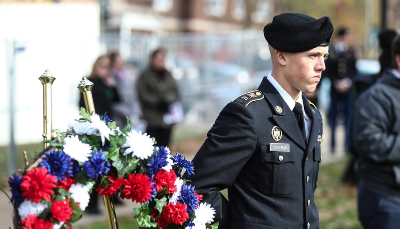 ROTC Cadet stands by a memeorial wreath