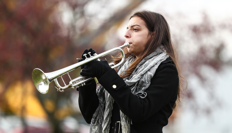 Woman plays taps