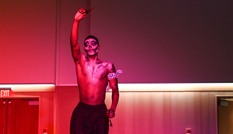 Man dancing in make up and costume