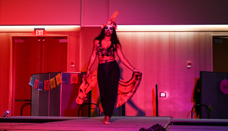 Woman dancing in make up and costume