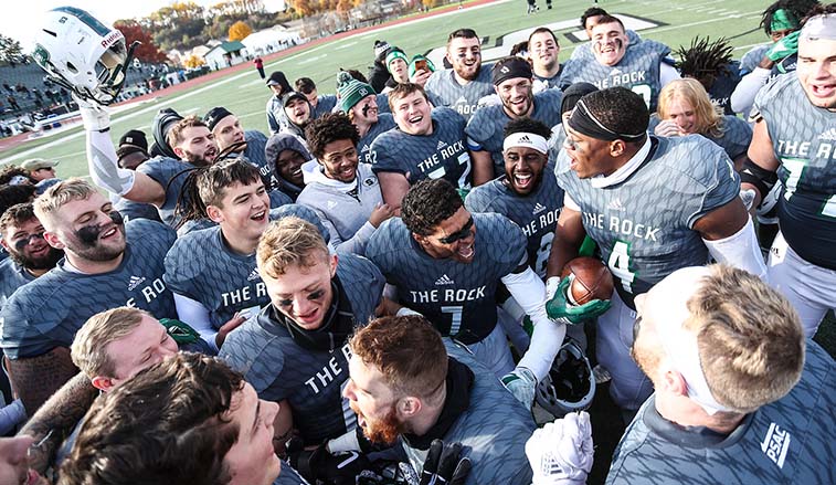 The football team celebrates after a victory