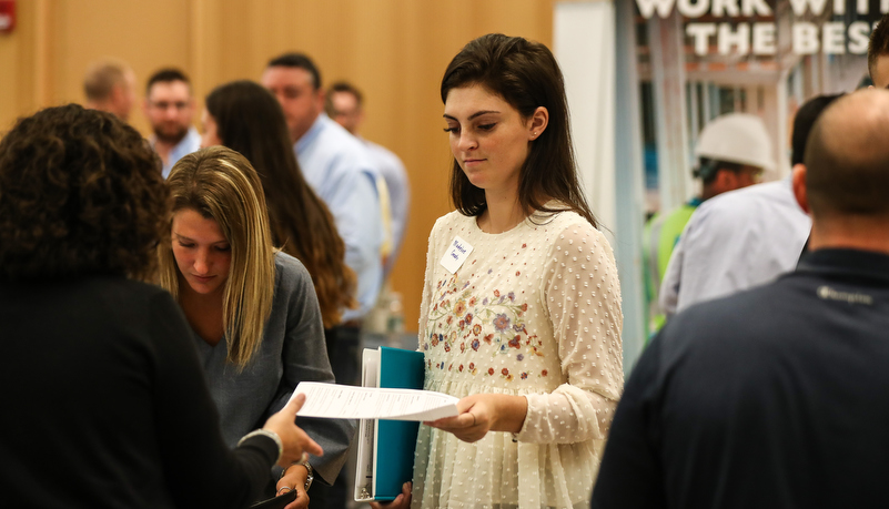 students talking to employers