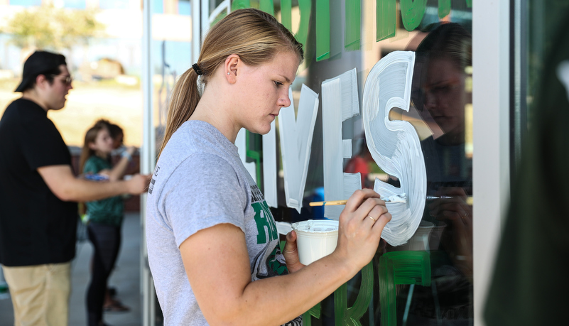 Students painting windows