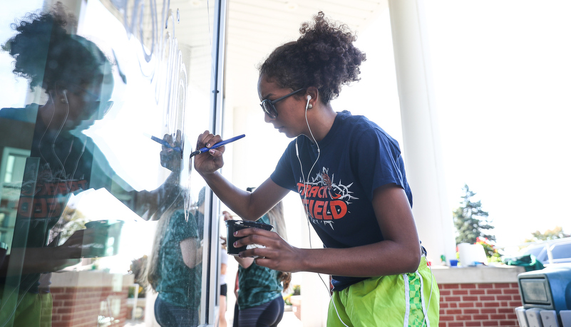 Students painting windows