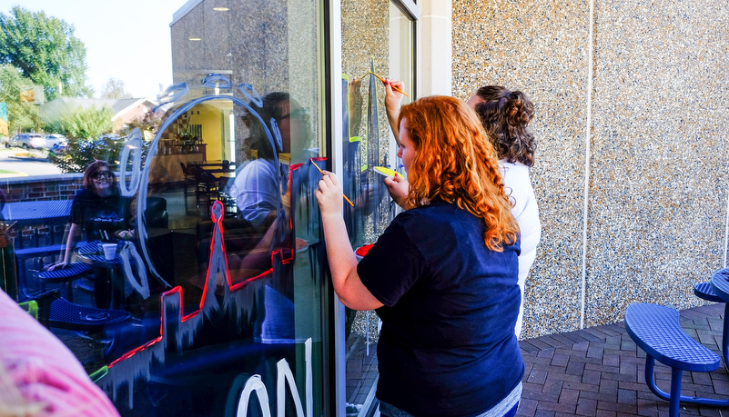 Students painting windows