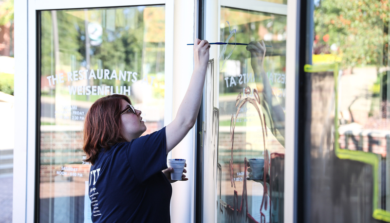 Students painting windows