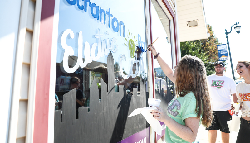 Students painting windows