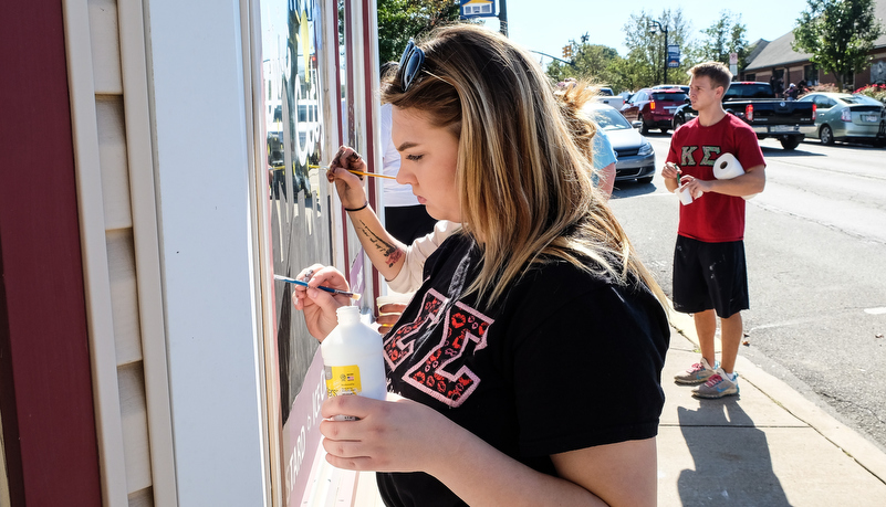 Students painting windows