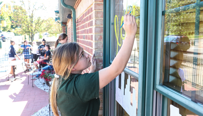 Students painting windows