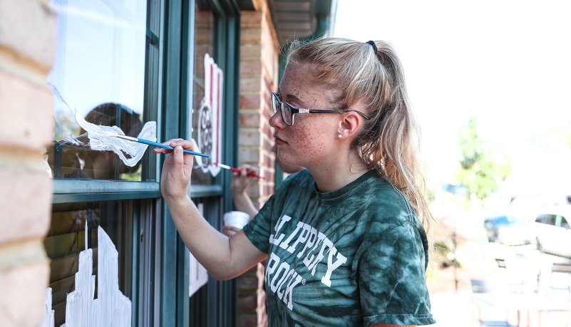 Students painting windows