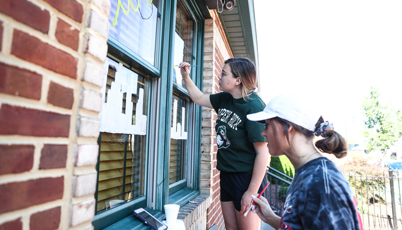 Students painting windows