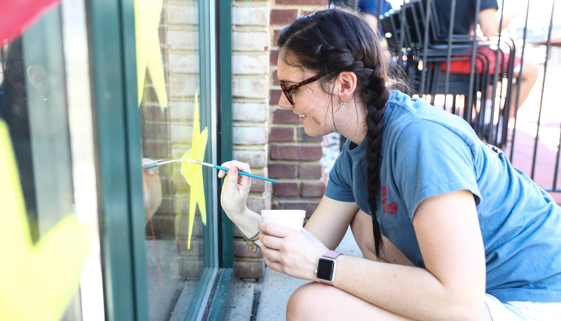 Students painting windows