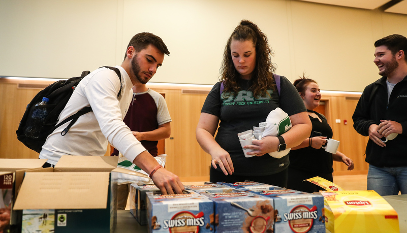 Students filling mugs