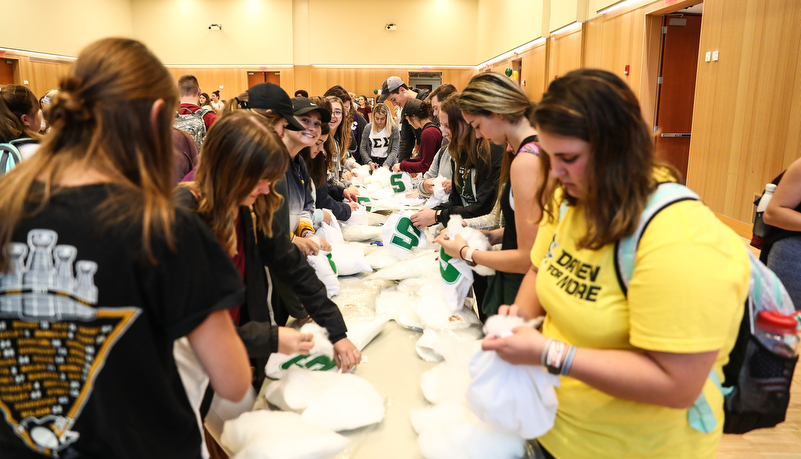 Students stuffing pillows