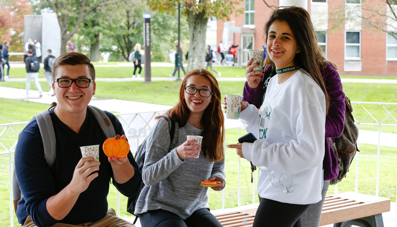 Students painting pumpkins