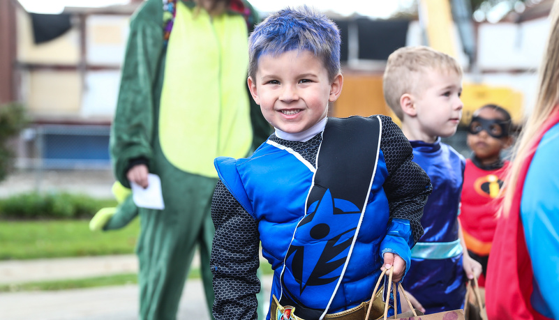 boy dressed in a super hero costume