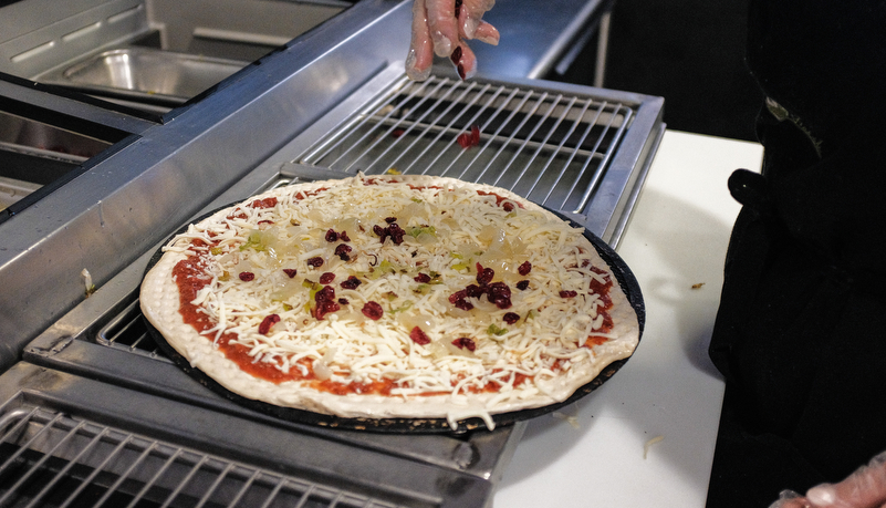 AVI cook making pizza