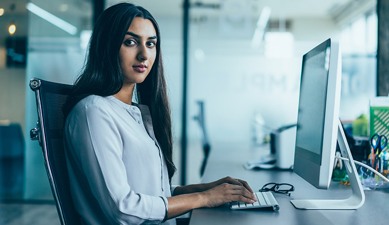 Woman sitting at a computer