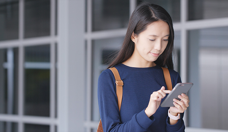 Female student on a mobile device
