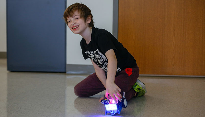 child testing his new robot 