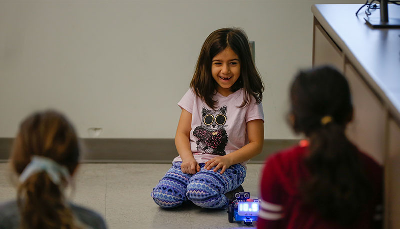 child playing with new robot creation