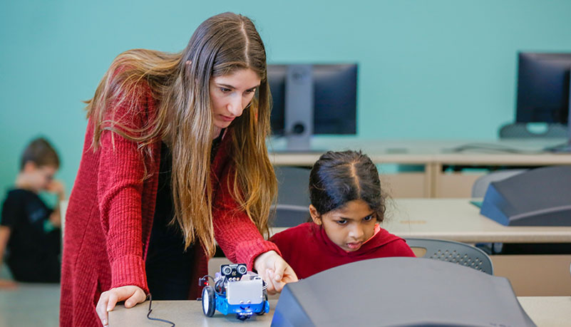 teacher helping child