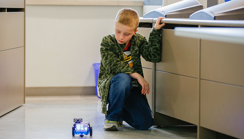 child watching robot