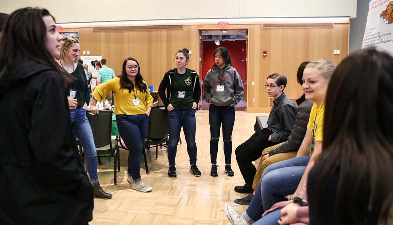 High school students listening to a presentation