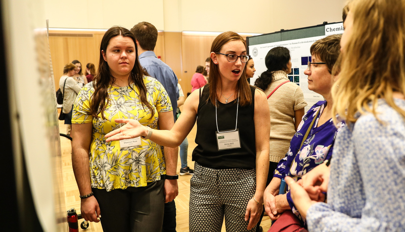 Students presenting their research