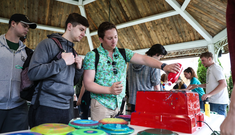 Students making frisbees