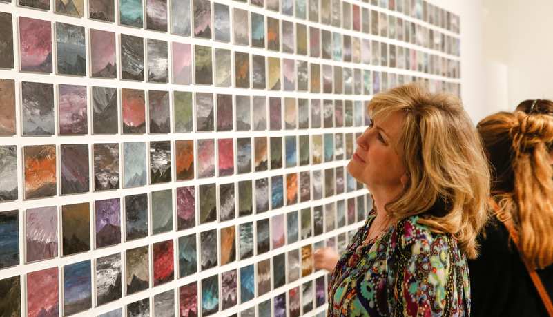 Woman looking at art